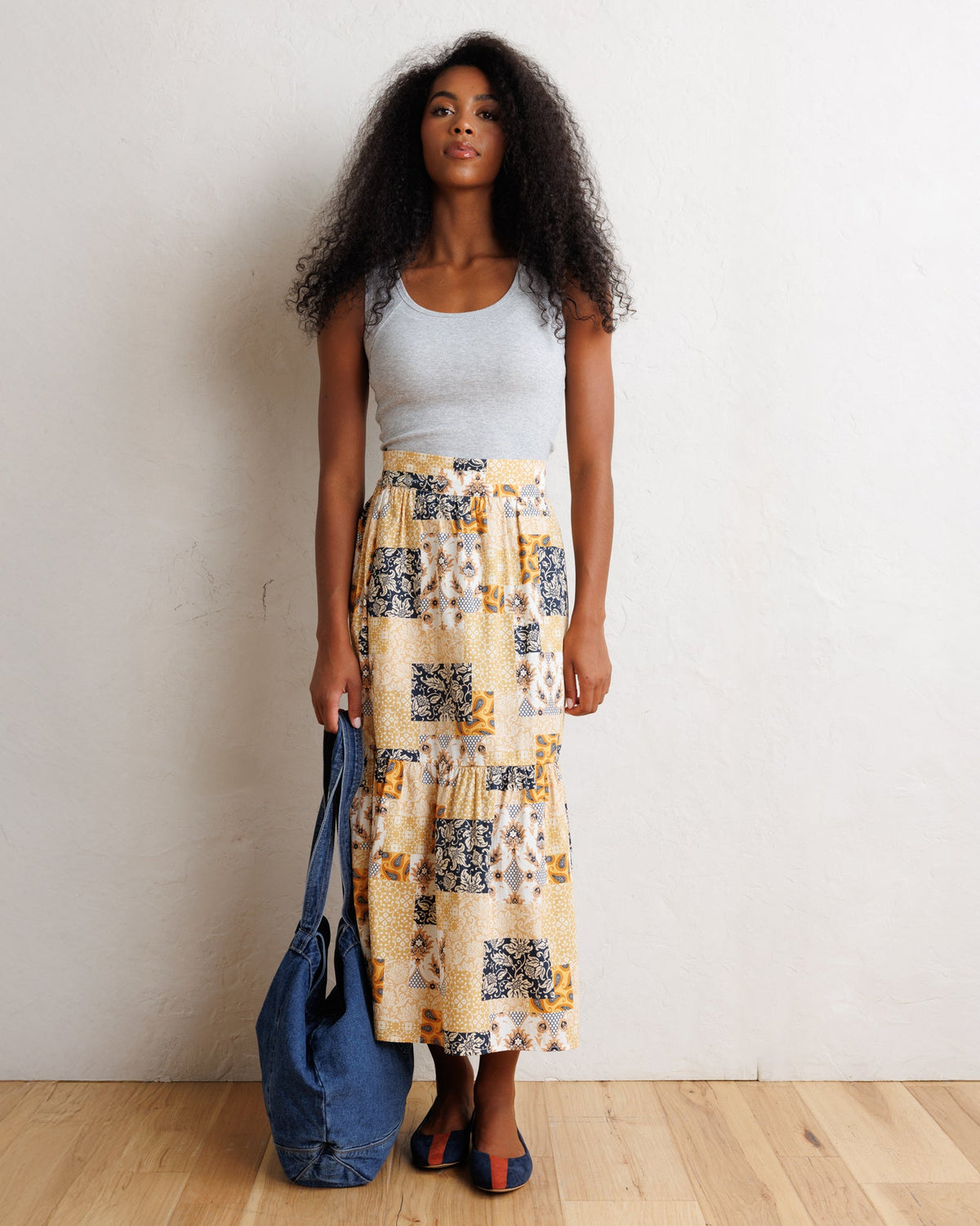Tiered patchwork midi skirt in orange and cream with navy block pattern