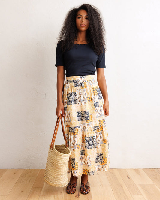 Tiered patchwork midi skirt in orange and cream with navy geometric prints