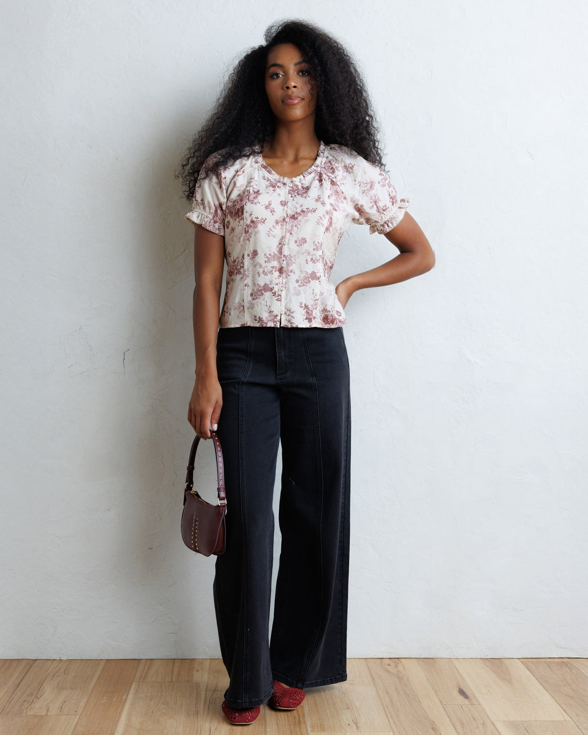 La Vie En Rose top with pale floral print, short puff sleeves, and gathered waist.