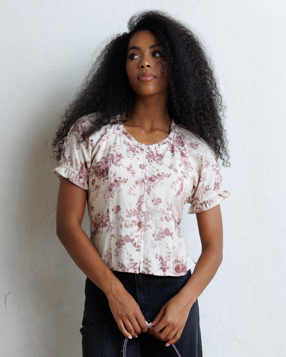 La Vie En Rose top in pale floral print with ruffled neckline and elastic puff sleeves.