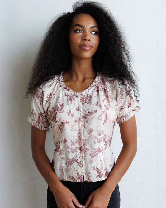 La Vie En Rose top in pale floral print with puff sleeves and gathered neckline.