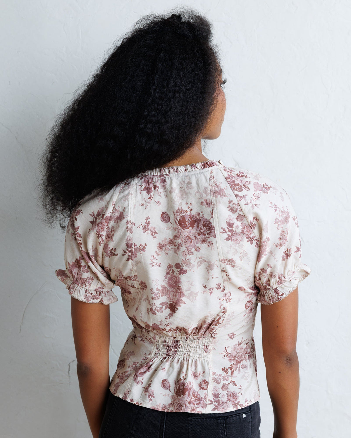 La Vie En Rose top back view in pale floral print with elasticated sleeves and yoke.