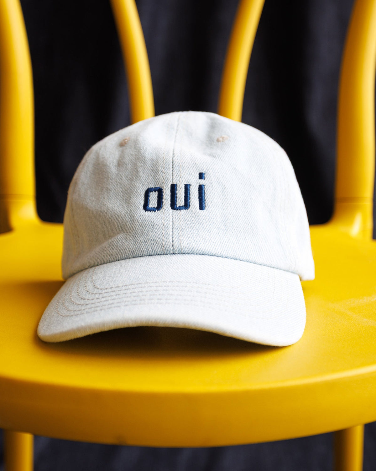 Washed light-blue 'oui' cap with front logo and curved brim