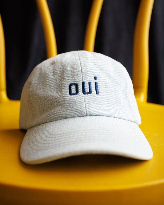 Washed light-blue cap with 'oui' embroidered logo on front panel