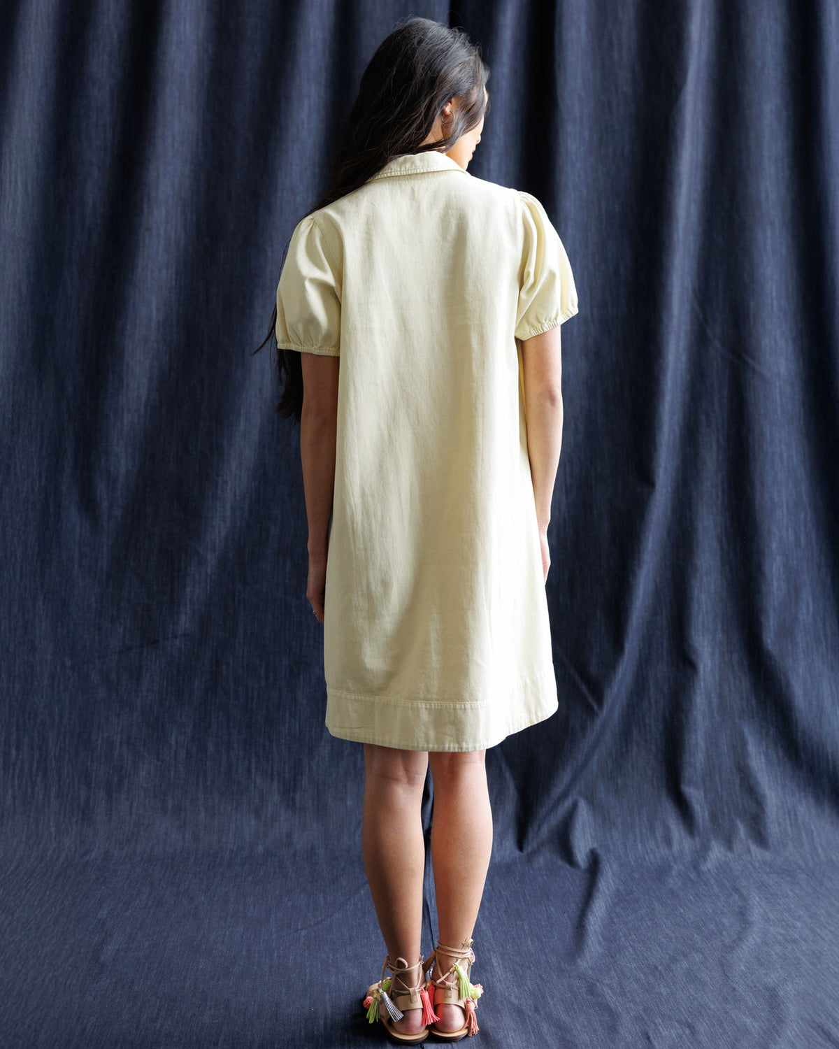 Light yellow denim dress, back view with short sleeves and straight hem