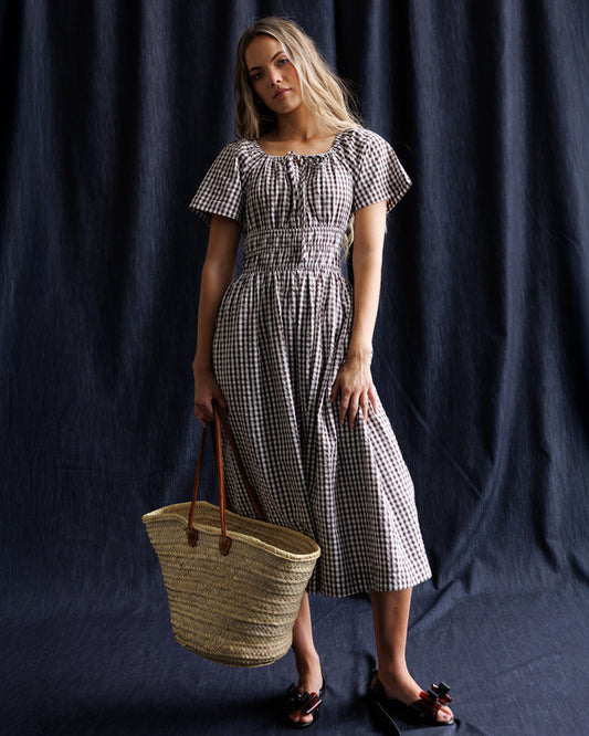 Maybelle dress with gingham pattern, puff sleeves, and ruched square neckline