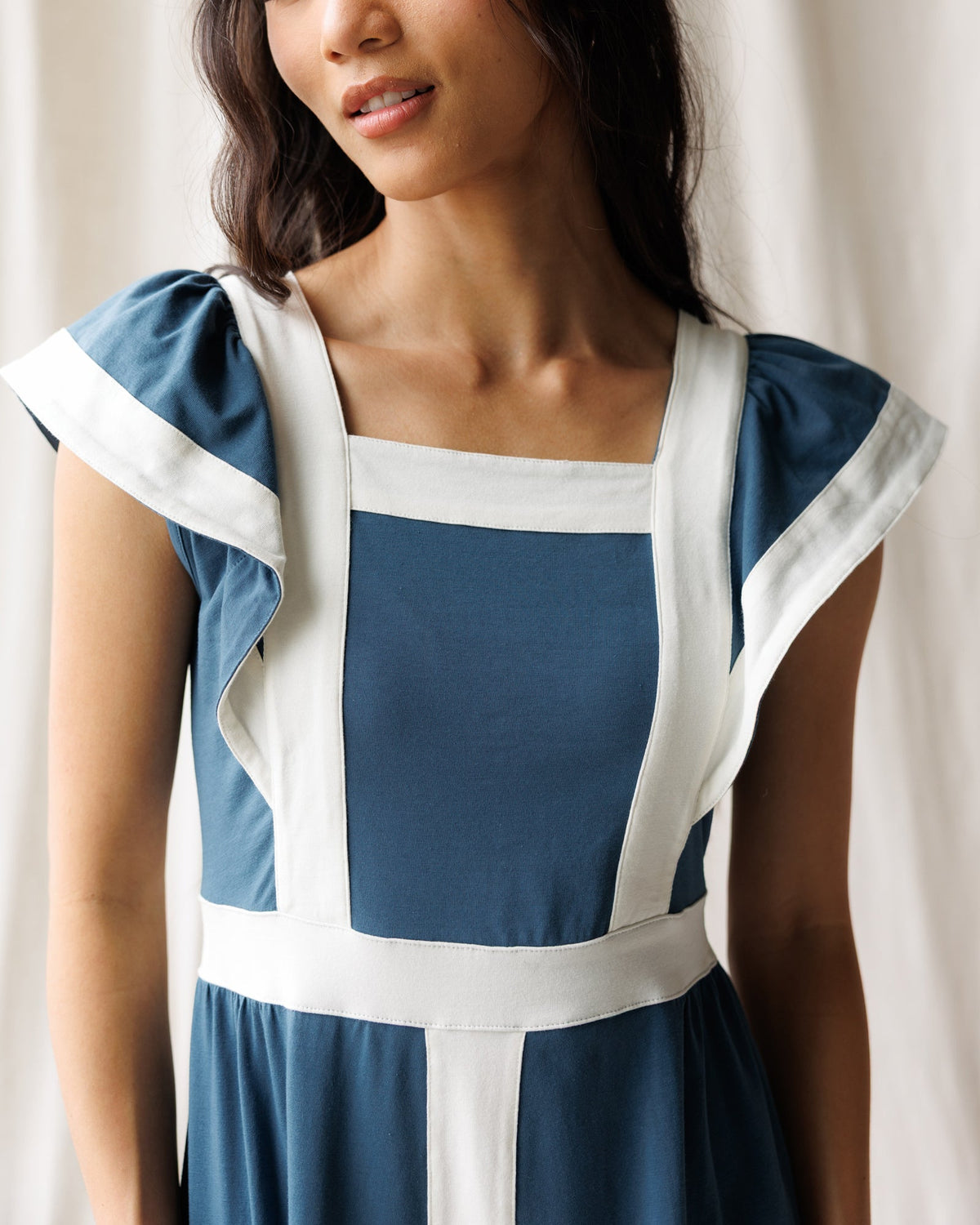 Women’s Block Party dress front close-up with square neckline and blue paneling