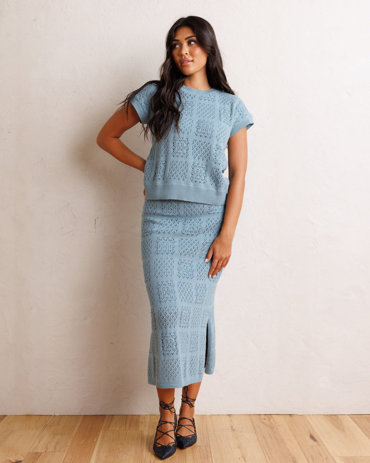 Smoke blue textured knit midi skirt with front slit and vertical pattern