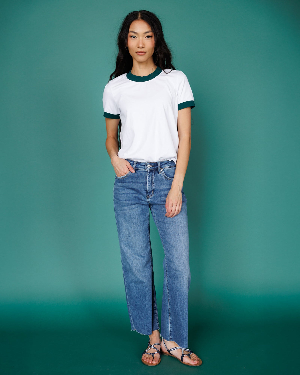 Bright white ringer T-shirt with dark green crew neck and sleeve trim