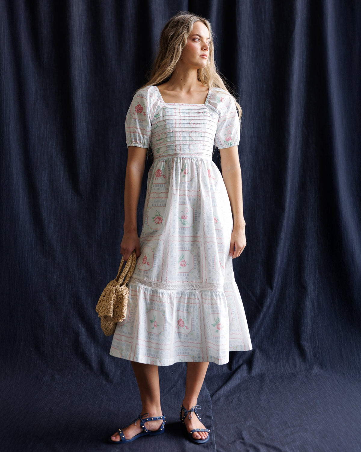 White embroidered-pattern midi dress with puff sleeves and ruffled trim