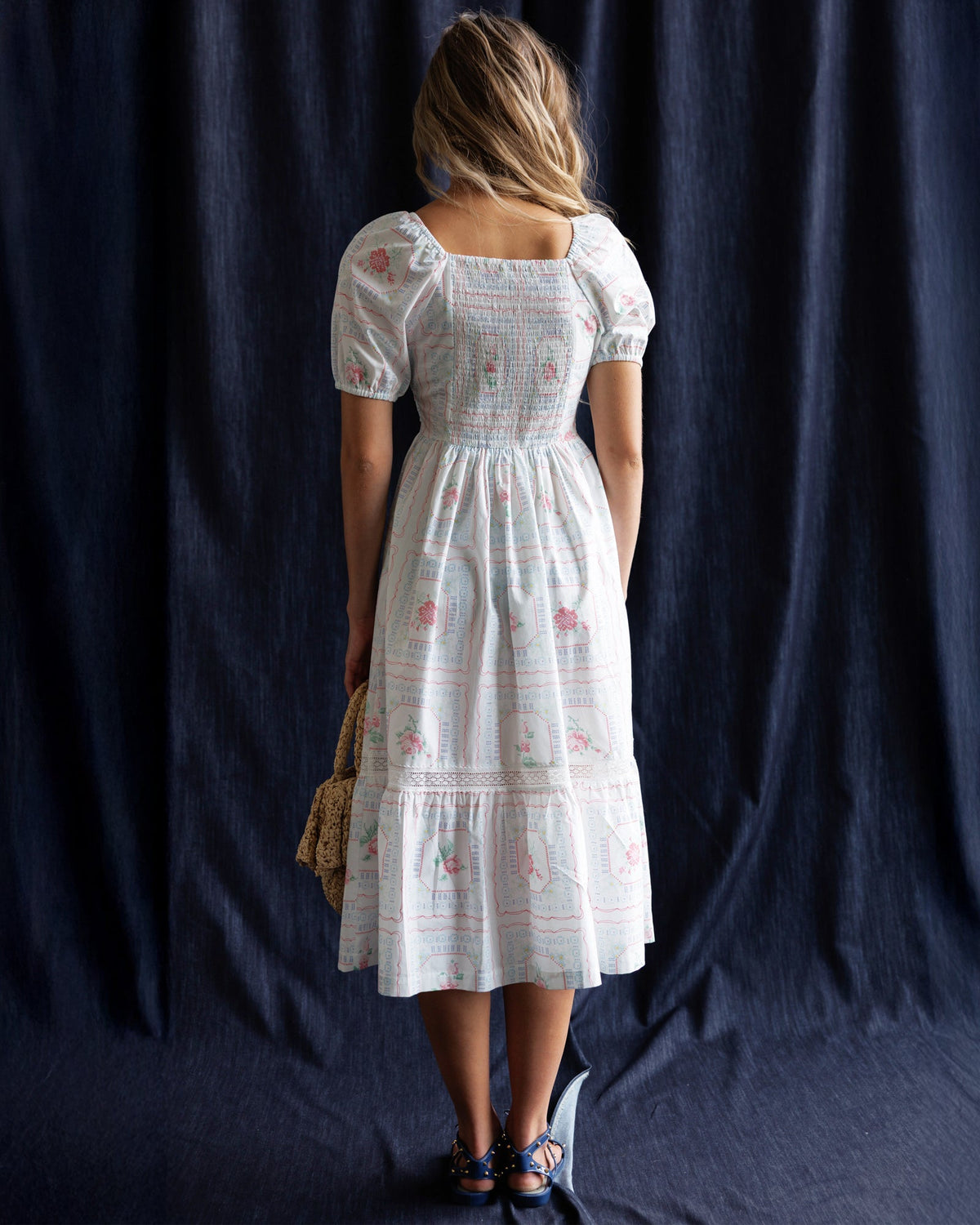 White tiered dress with puff sleeves and smocked back, gathered waist