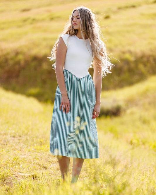 Gathered-waist sleeveless midi dress with white top and vertical blue-green striped skirt