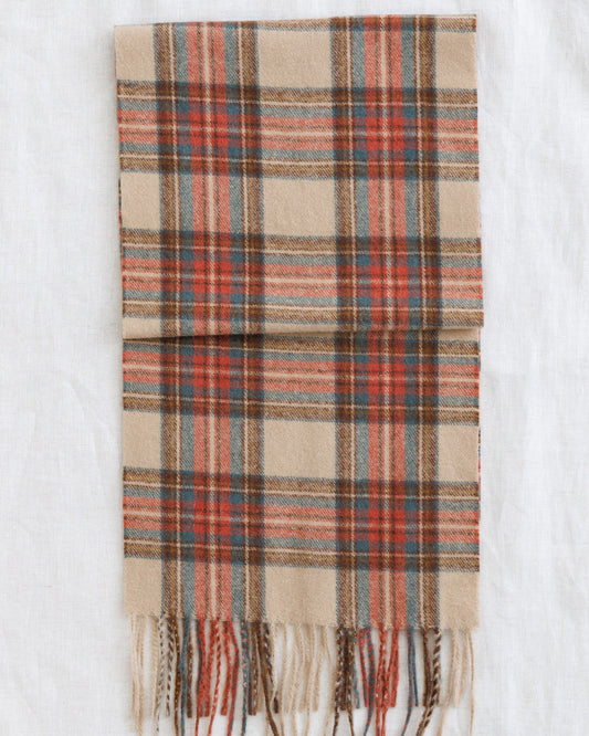 Plaid scarf in tan, rust, and blue with fringed ends
