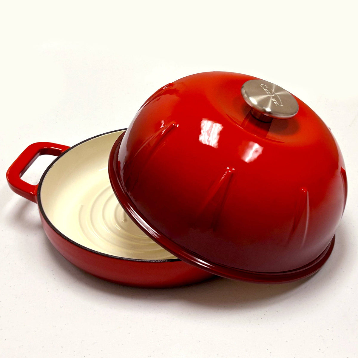 Red dome-lid Dutch oven with cast iron base and side handles