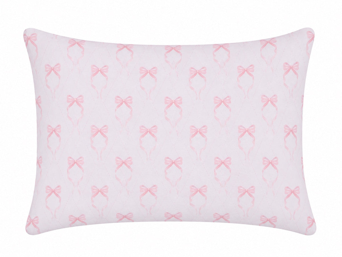 Pillowcase with a repeating pink bow print on white
