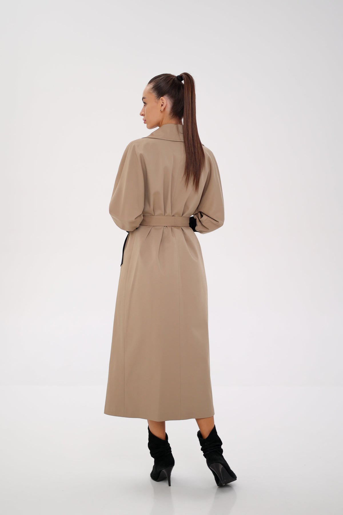 Miru camel trench coat shown from the rear at an angle, with a cinched waist