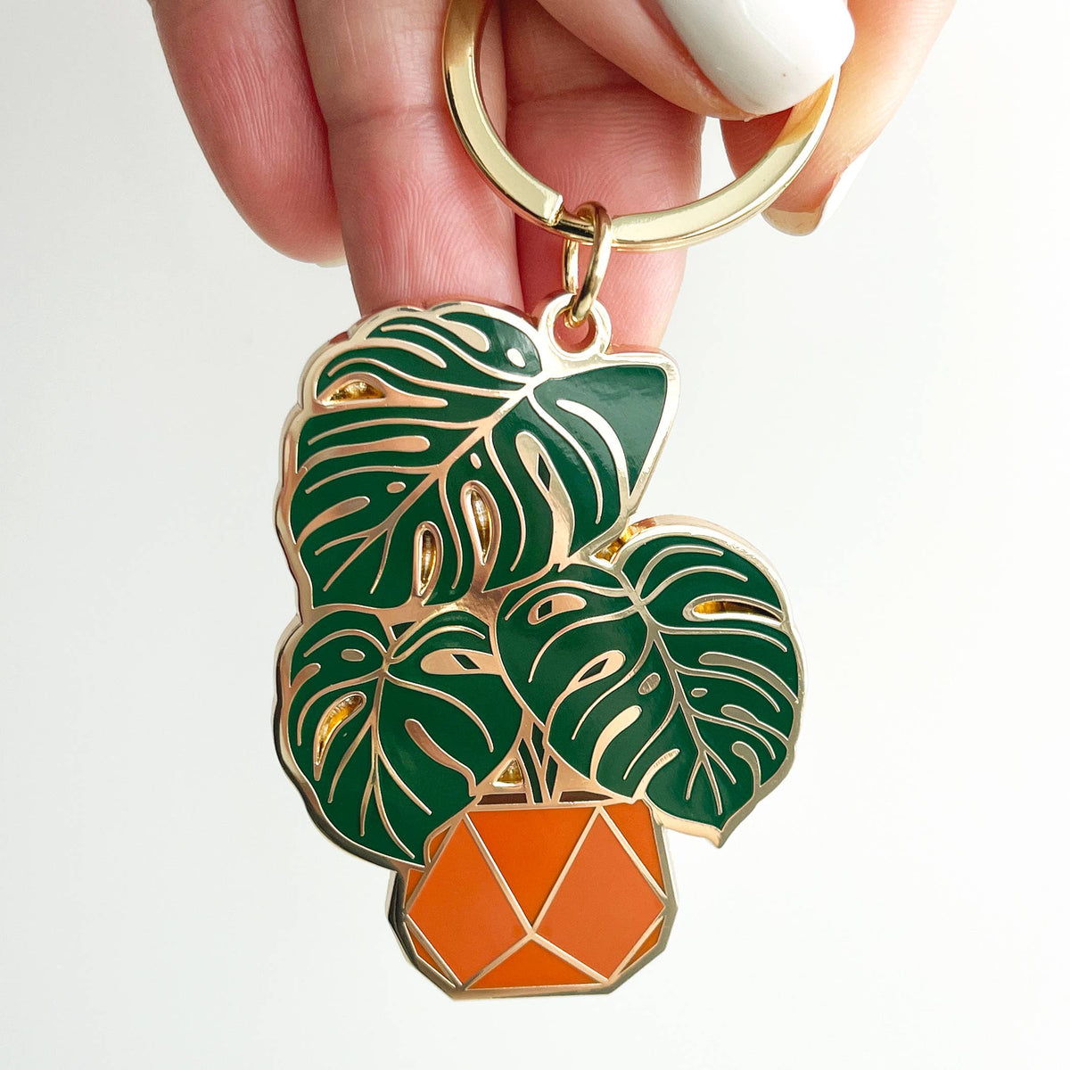 Enamel monstera leaf keychain with gold ring, green leaves and orange pot