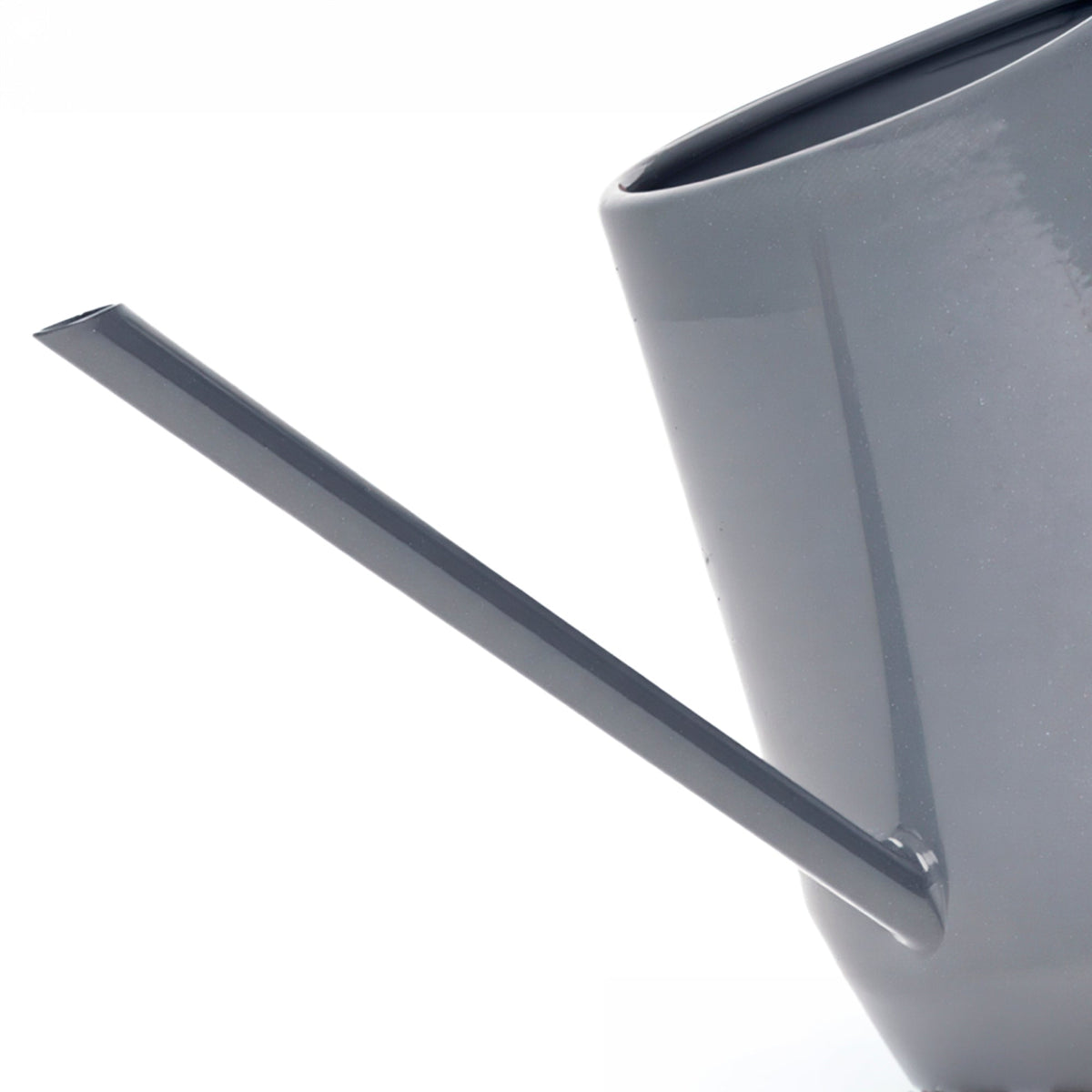 Charcoal indoor watering can spout close-up with smooth curved body