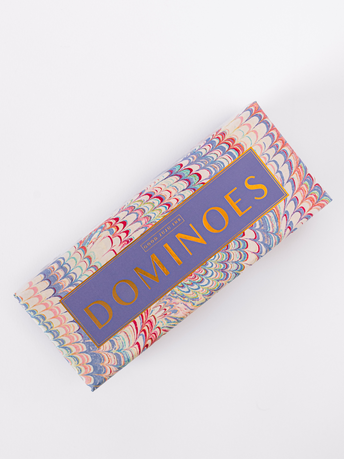 Domino set storage box with marbled pattern and large “DOMINOES” title