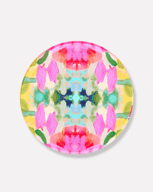 Round acrylic drink coaster with pink, green, and blue floral confetti pattern