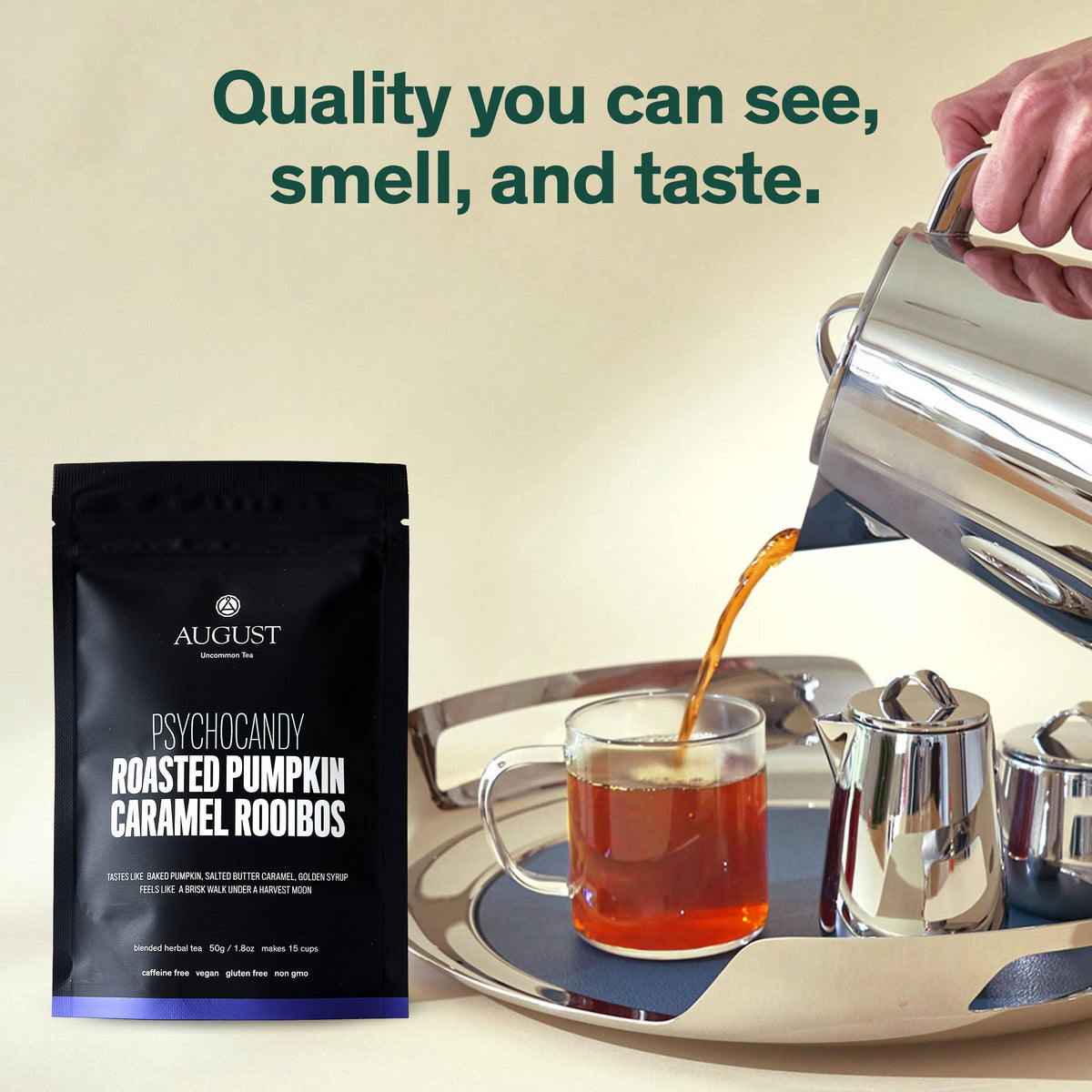 Psychocandy tea pouch beside a glass of amber tea being poured from a metal pot.