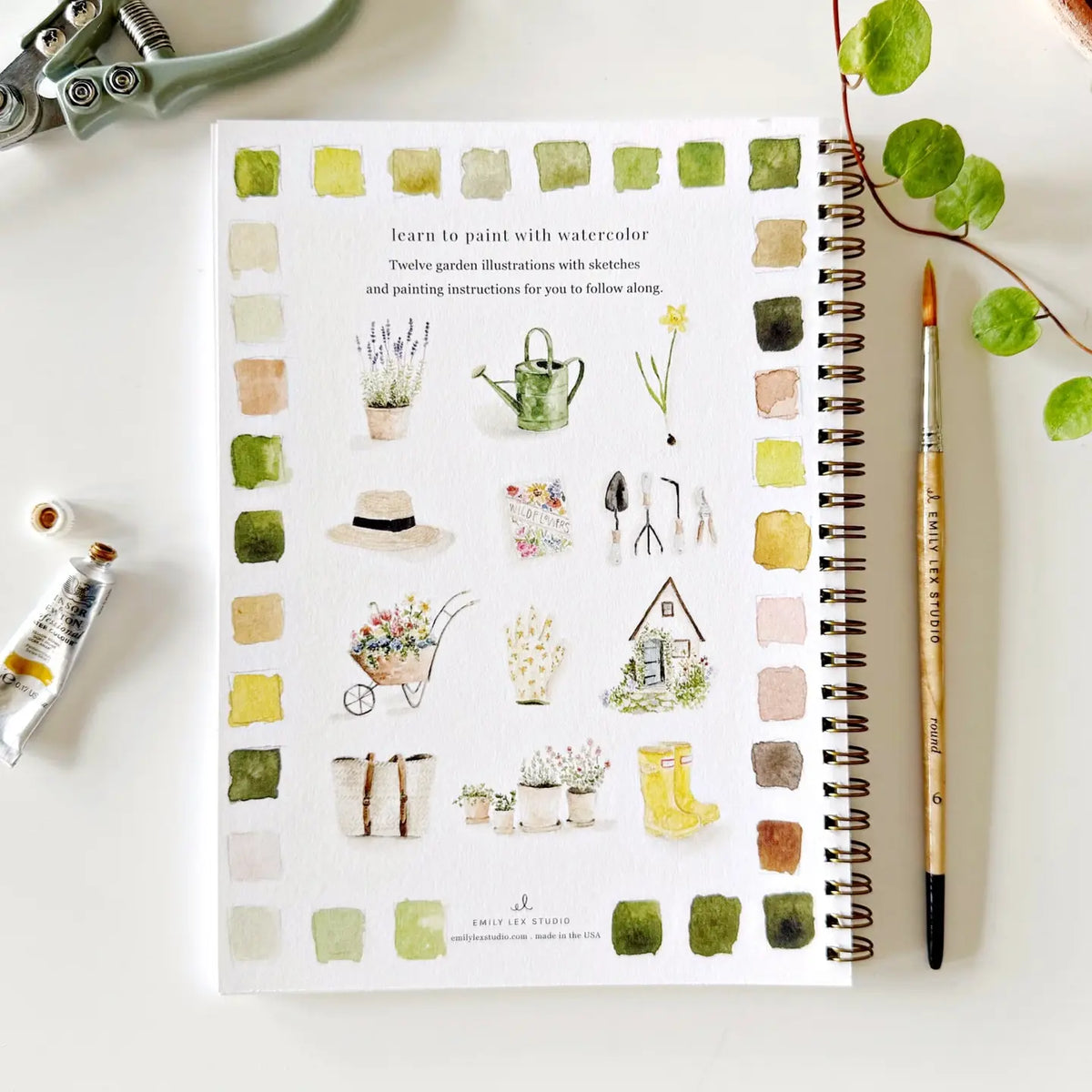 Garden watercolor workbook page with plant illustrations, color swatches, and painting instructions