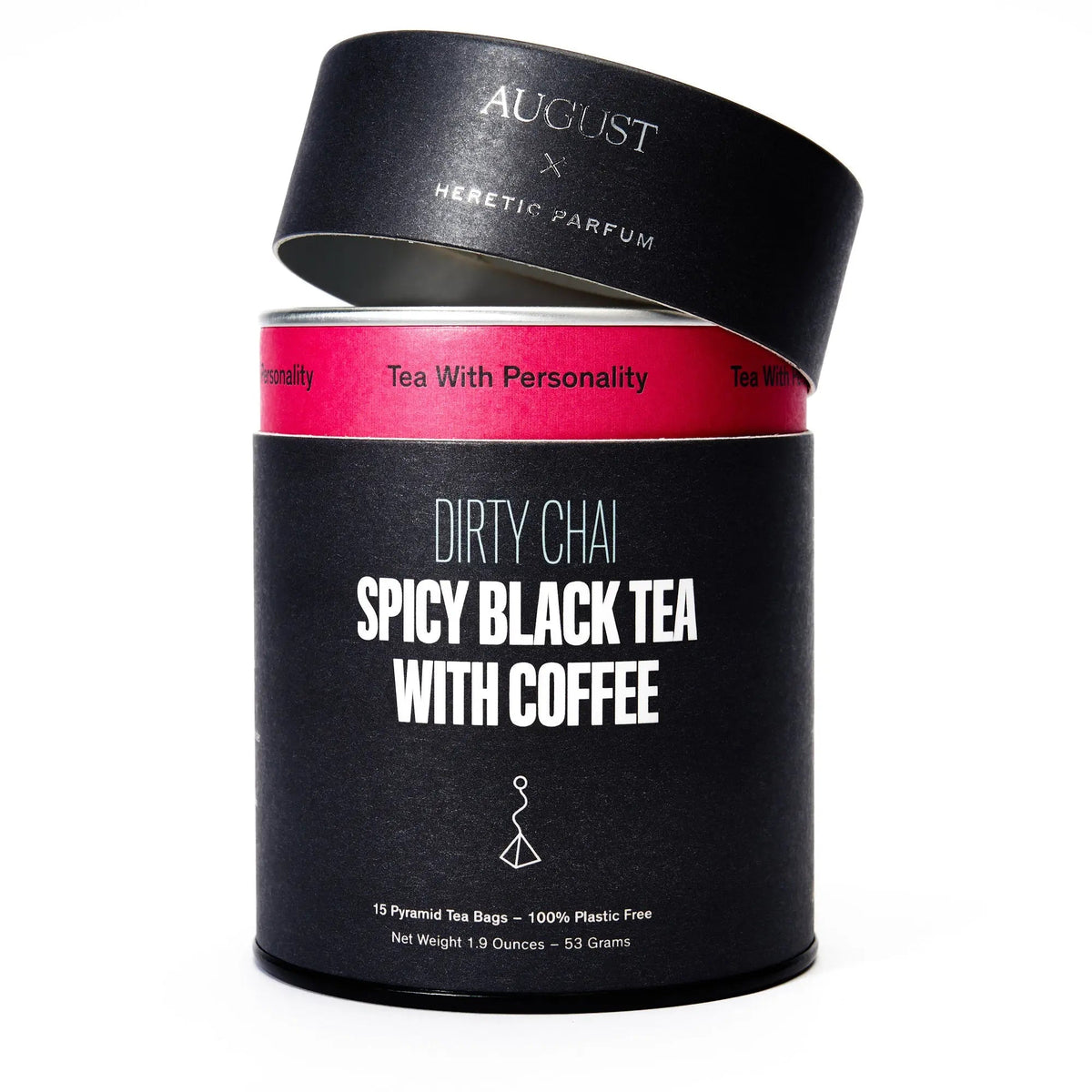 Open black Dirty Chai tea tin with a bright pink band inside the lid.