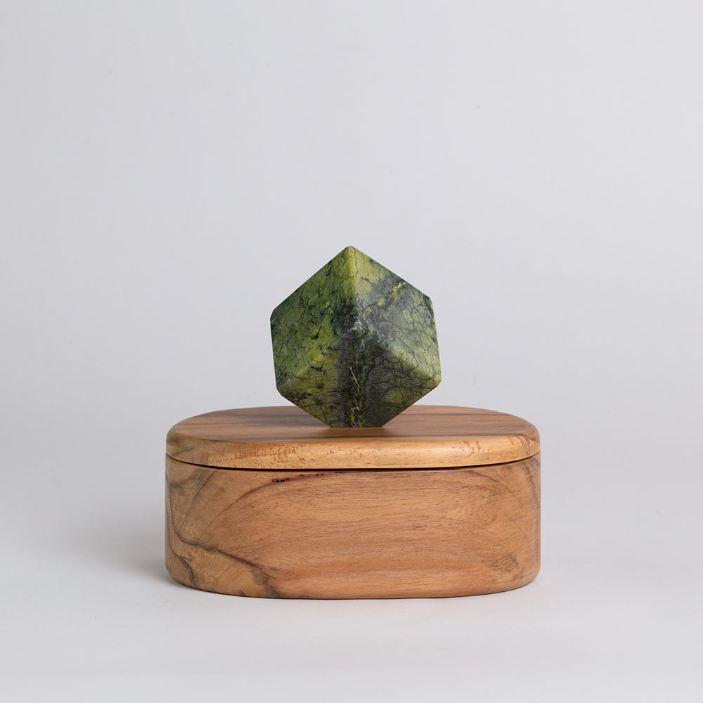 Oval wooden jewel box with green stone octagonal knob on lid