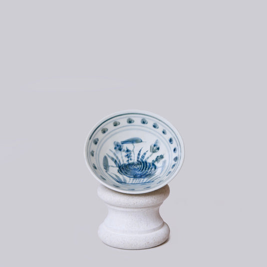 Small blue-and-white porcelain conical bowl on pedestal base, lotus pattern