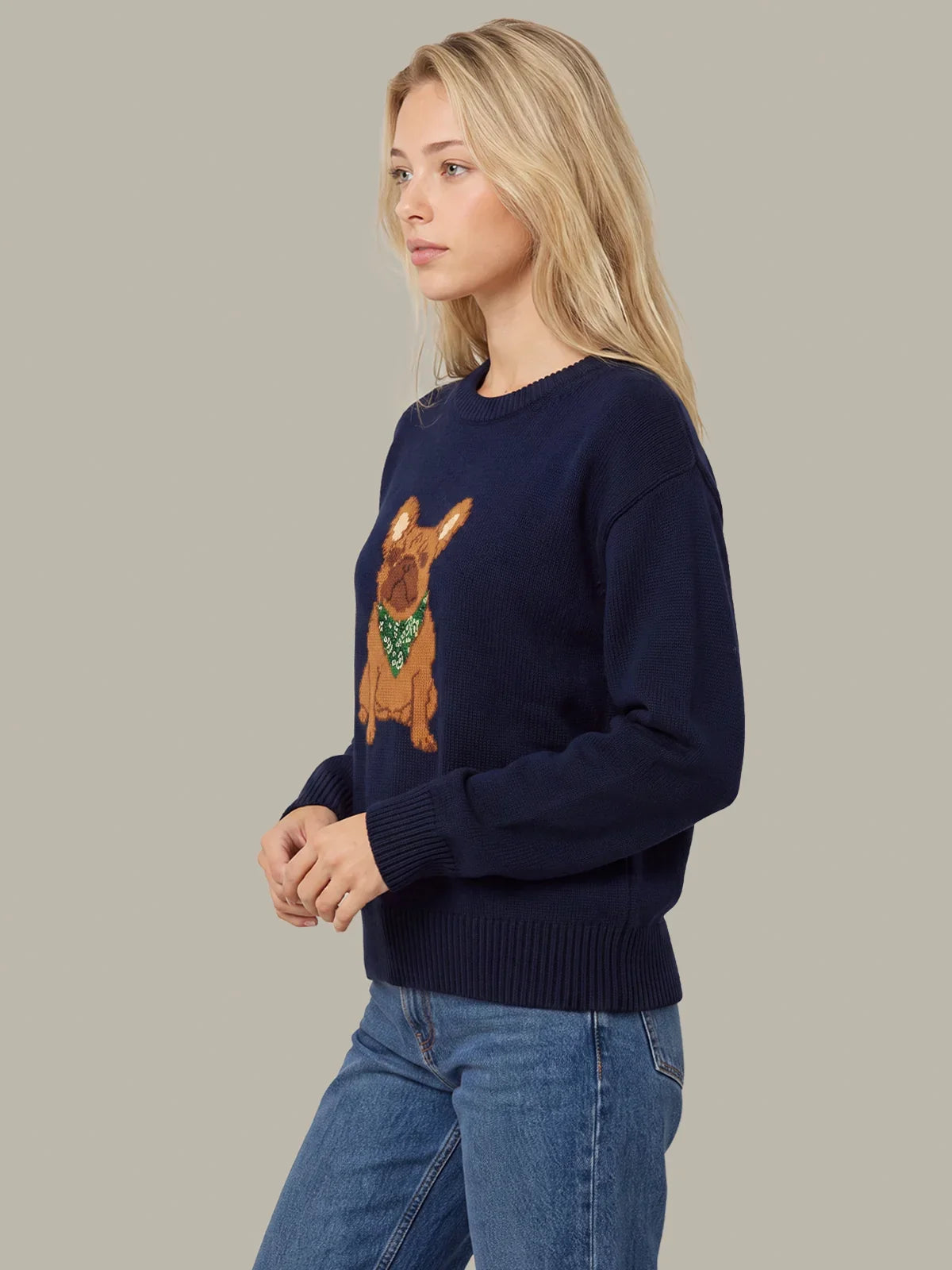Navy crewneck knit sweater with dog graphic, ribbed cuffs and hem, side view