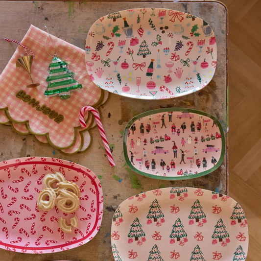 Melamine rectangular plates with assorted holiday prints, including candy canes and trees