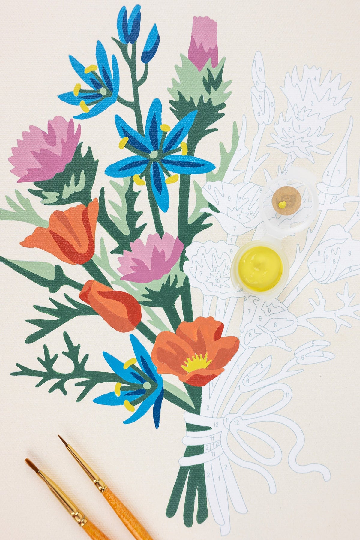 Wildflower paint-by-number canvas with bright floral stems, brush tips, and paint circles