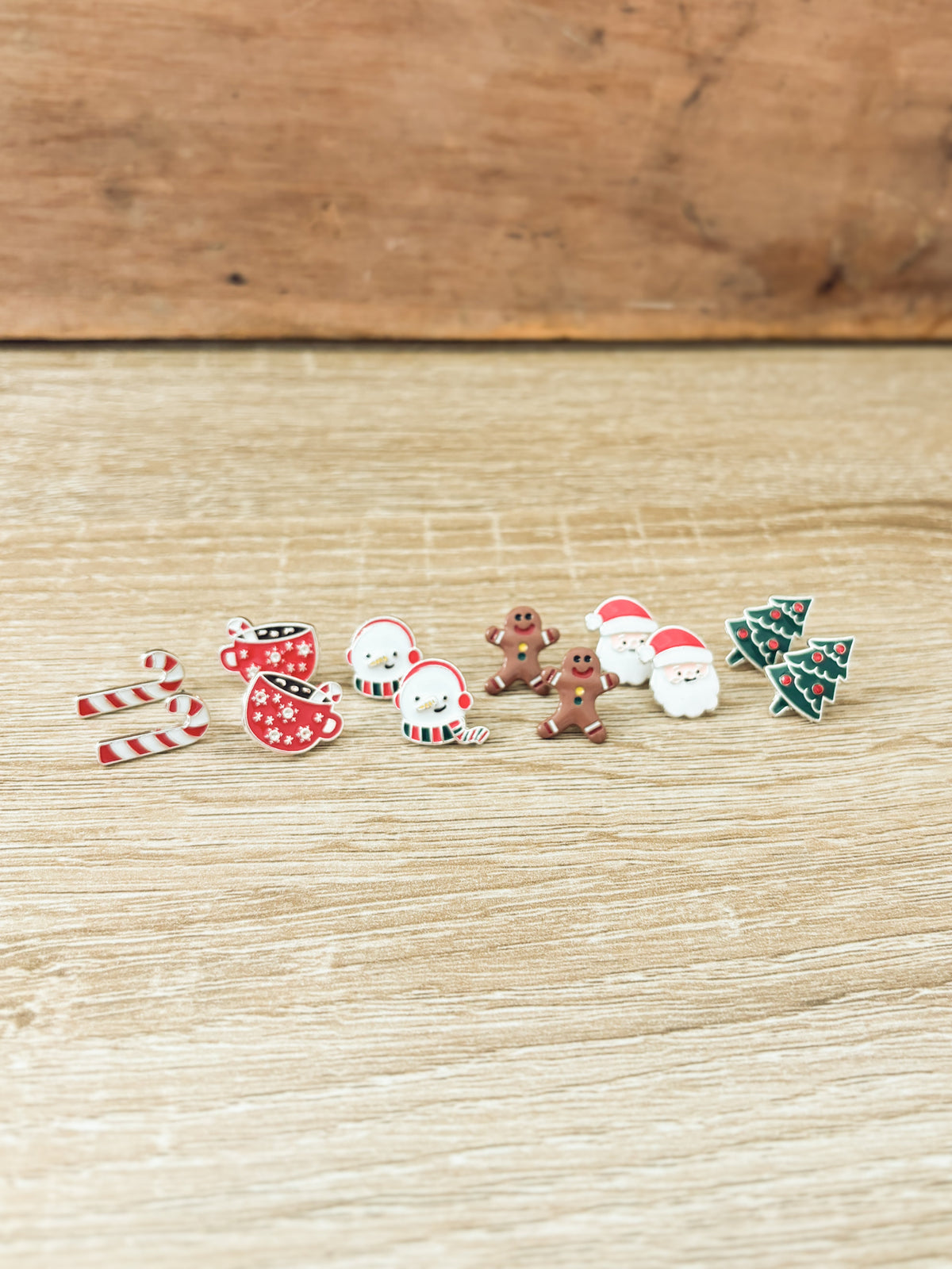 Christmas stud earring set with candy cane, gingerbread, snowmen, Santa, and tree charms