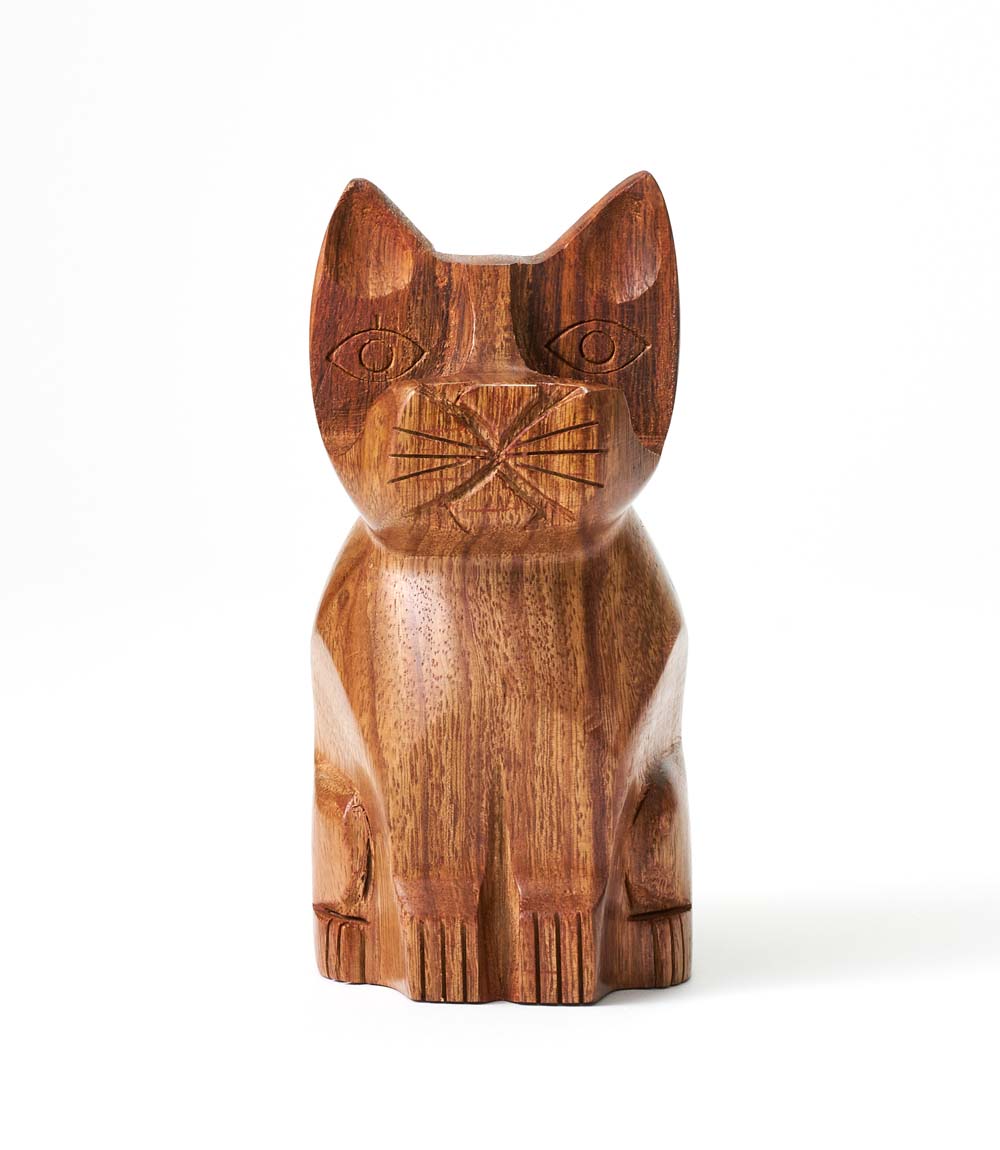 Hand-carved wooden cat eyeglass holder stand, close-up of face and carved whiskers