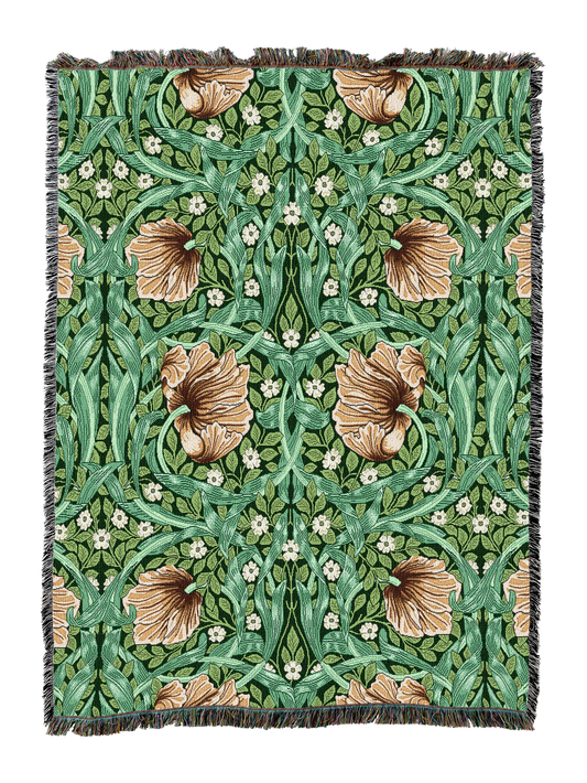 Green floral blanket with scalloped fringe and bird-and-leaf ornament pattern