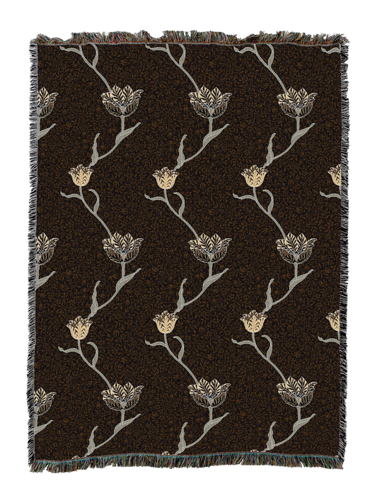 Garden tulip blanket with dark brown backdrop and cream tulip stems; fringed border