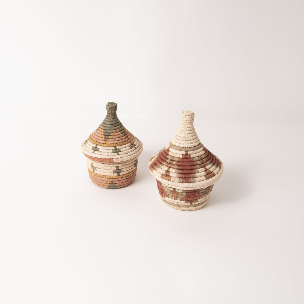 Pair of small woven coffee baskets with matching lids, earth-tone stripe weaving