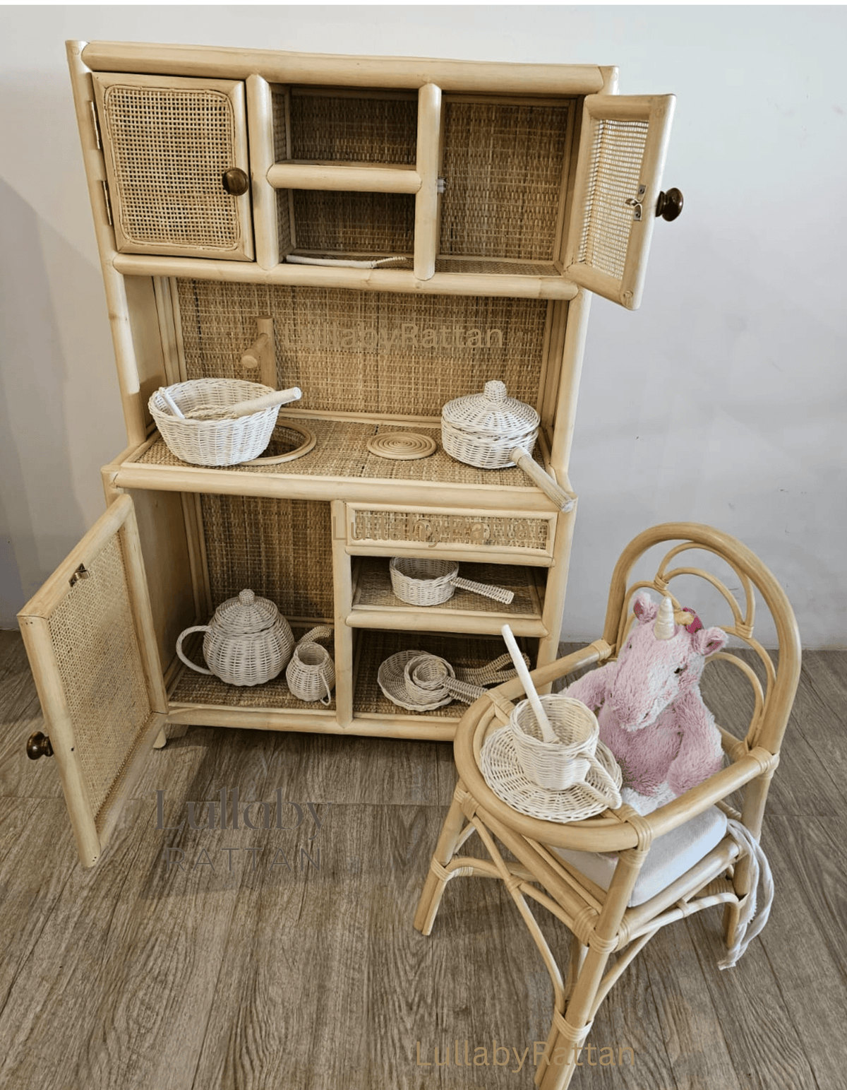 Rattan doll high chair with plush bunny and miniature dishes
