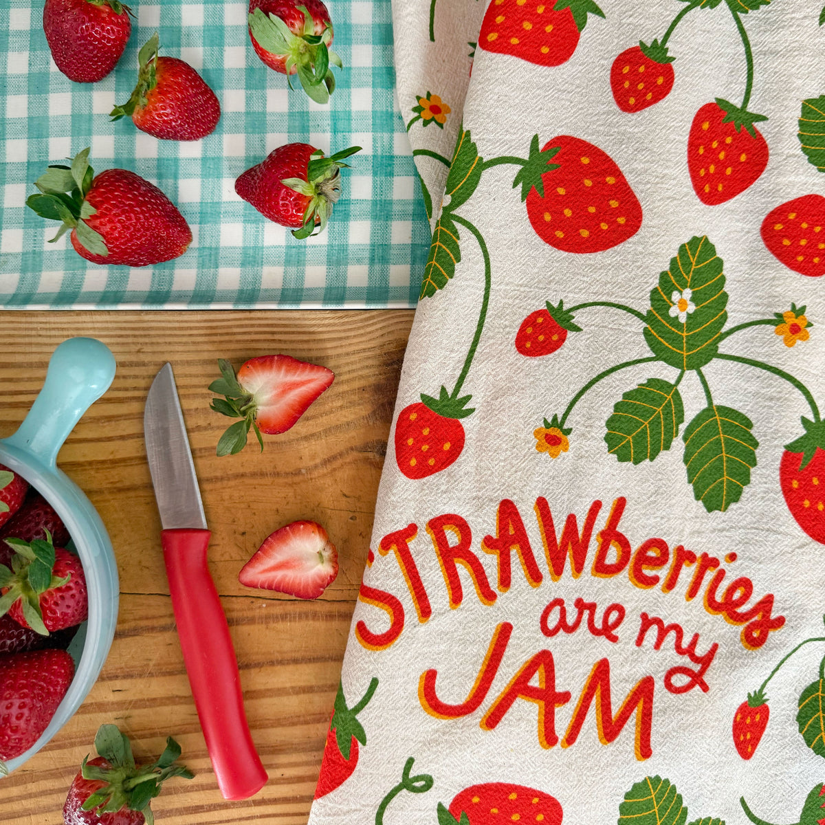 Cream towel corner detail with strawberry pattern and “Strawberries are my JAM”