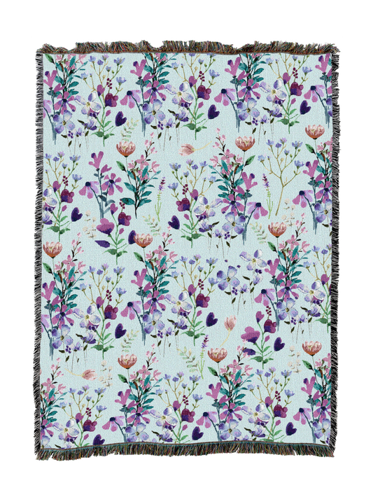 Floral bloom blanket with purple and pink wildflower print and fringed border