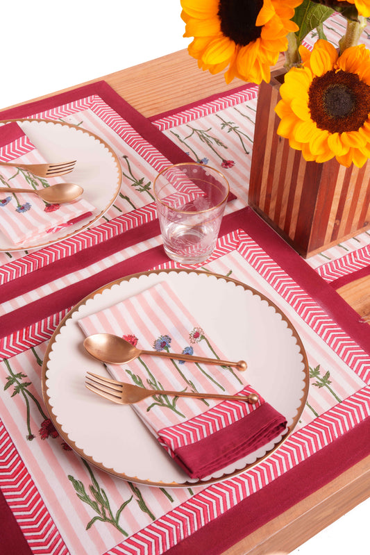 Set of 2 floral placemats with light pink base and red chevron edges for dining