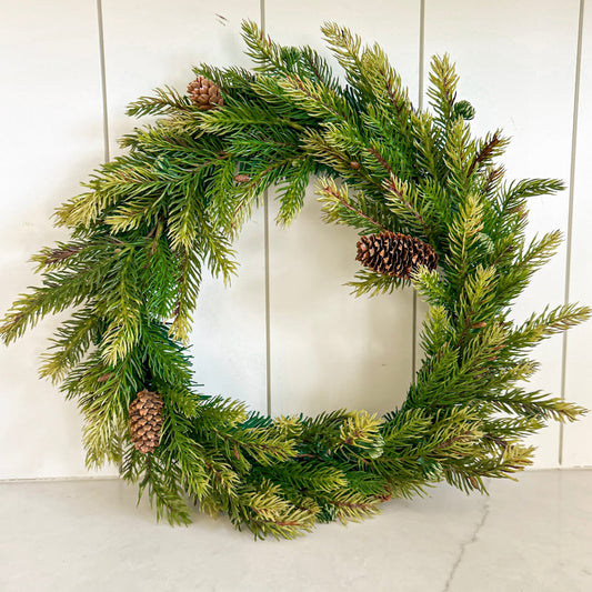 12-inch green pine wreath with natural-looking evergreen branches and pine cones