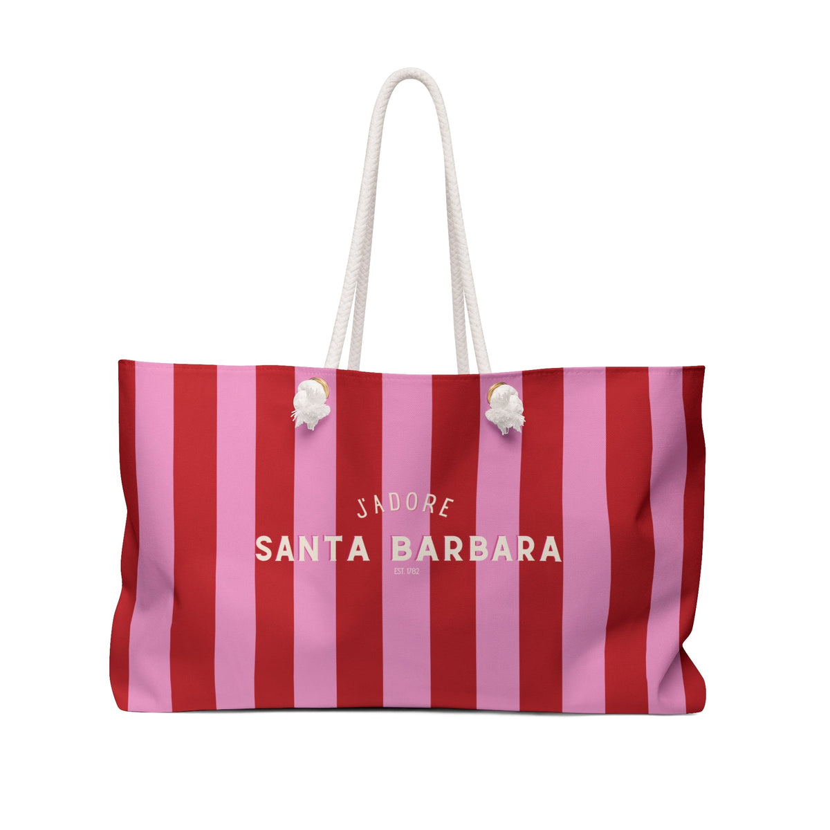 Striped pink and red weekender tote bag with white rope handles and charm details