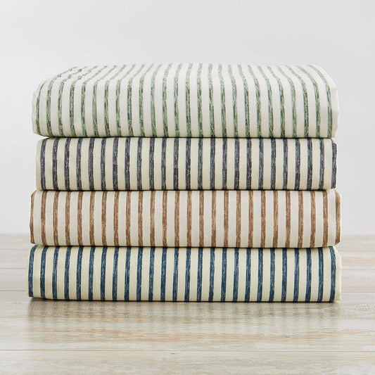 Striped microfiber sheet set with folded flat sheets in green, blue, taupe, and navy