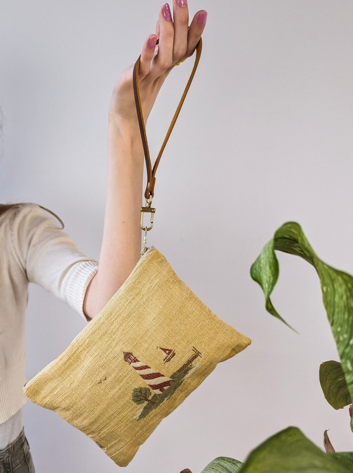 Linen wristlet with lighthouse embroidery and detachable brown leather strap