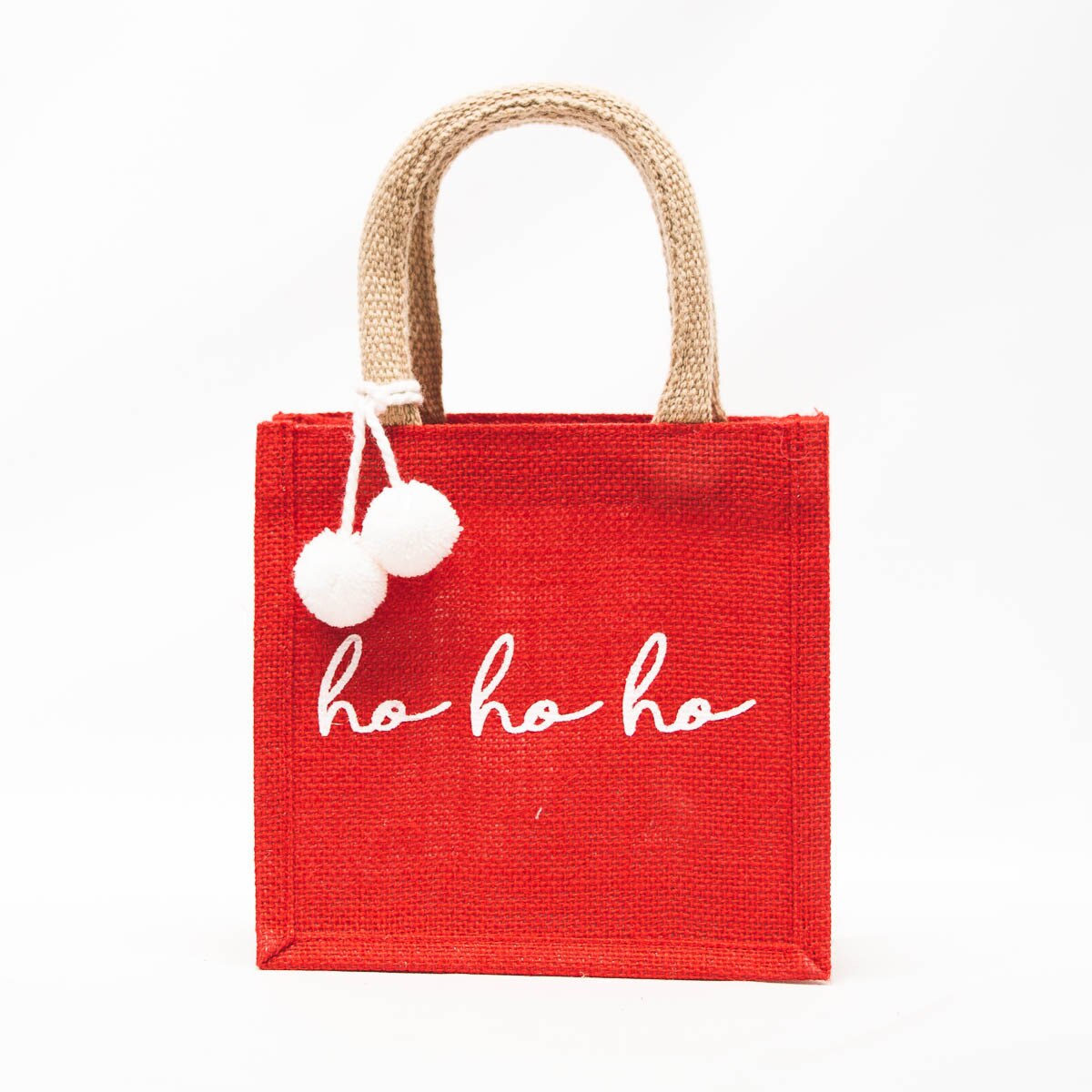Red small gift tote bag with jute handles, white 'ho ho ho' text and pom accents