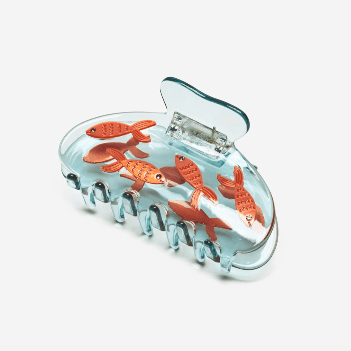 Transparent blue fish hair claw with orange goldfish cutouts and molded grip teeth