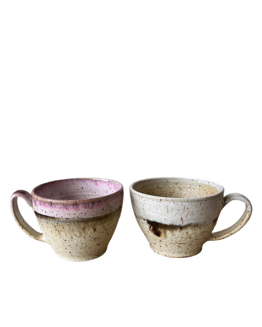 Pair of speckled ceramic cappuccino cups with purple glaze bands and side handles
