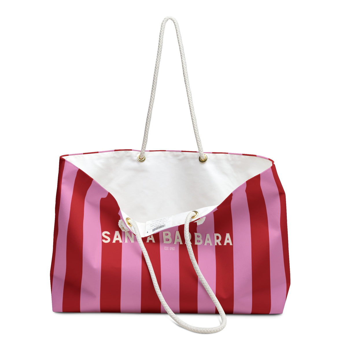 Striped pink and red beach weekender tote with white rope handles and front pocket