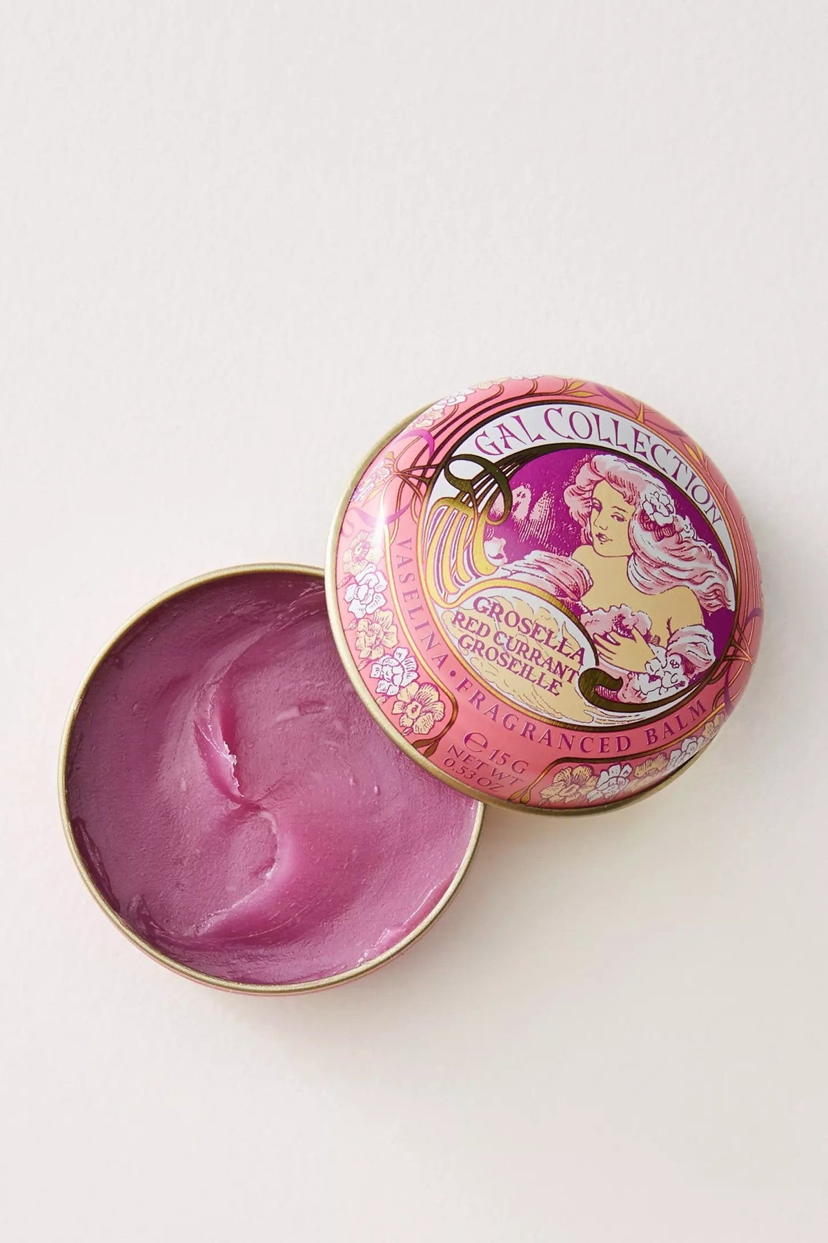 Perfumeria Gal scented lip balm in a tin, with mauve balm and illustrated lid